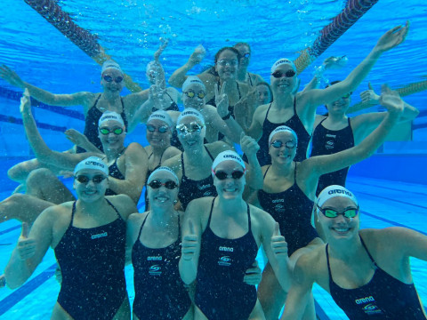 The girls have some fun under water.